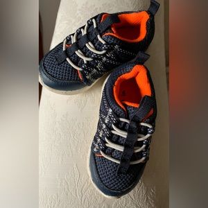 Baby Carter’s Tennis Shoes. Navy/Orange with speckled white/blue soles. Size 4.